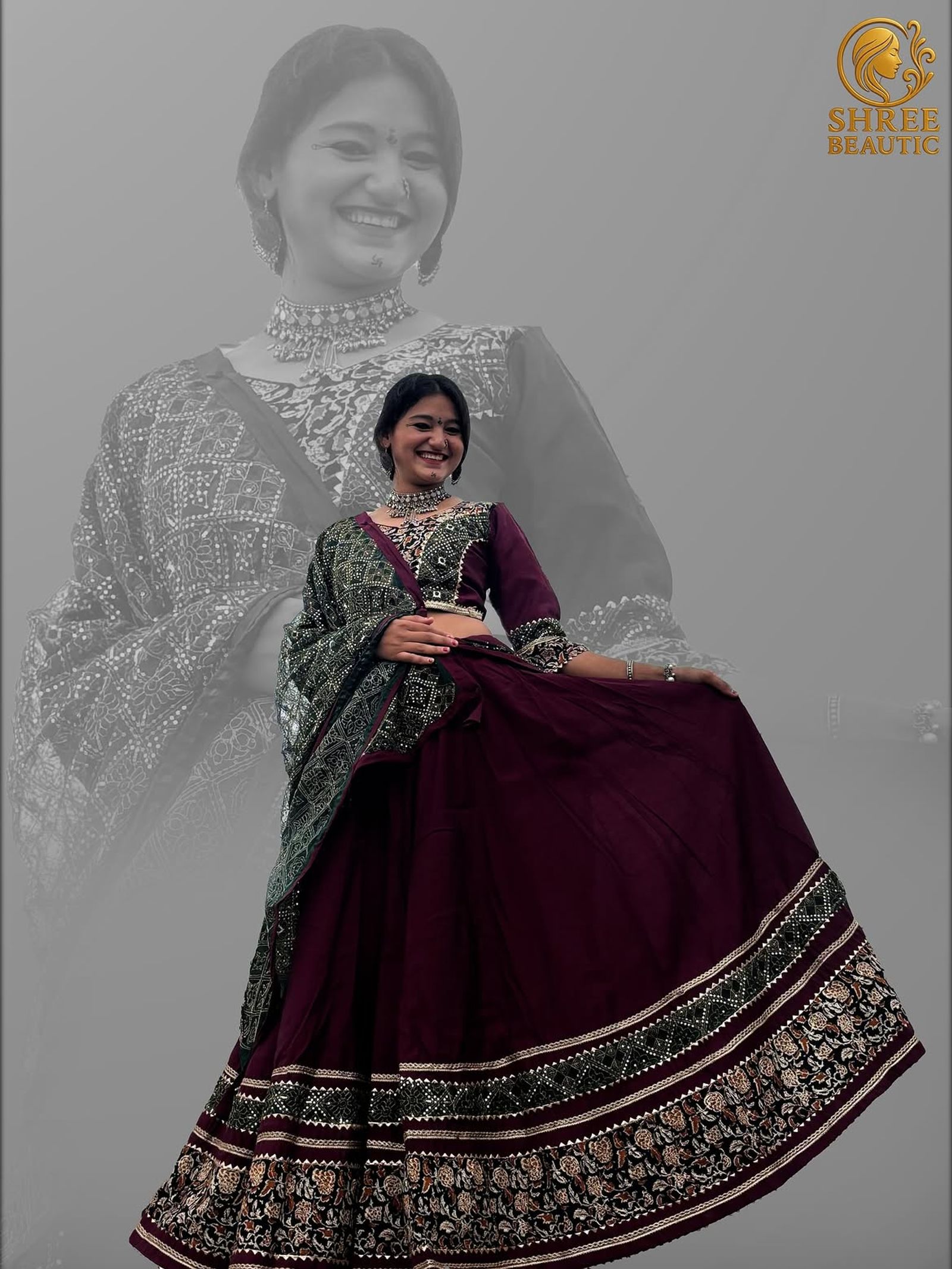 Standing view of the maroon lehenga spreading its wide black and green embroidered border