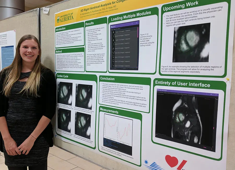 Mandy standing in front of her research poster