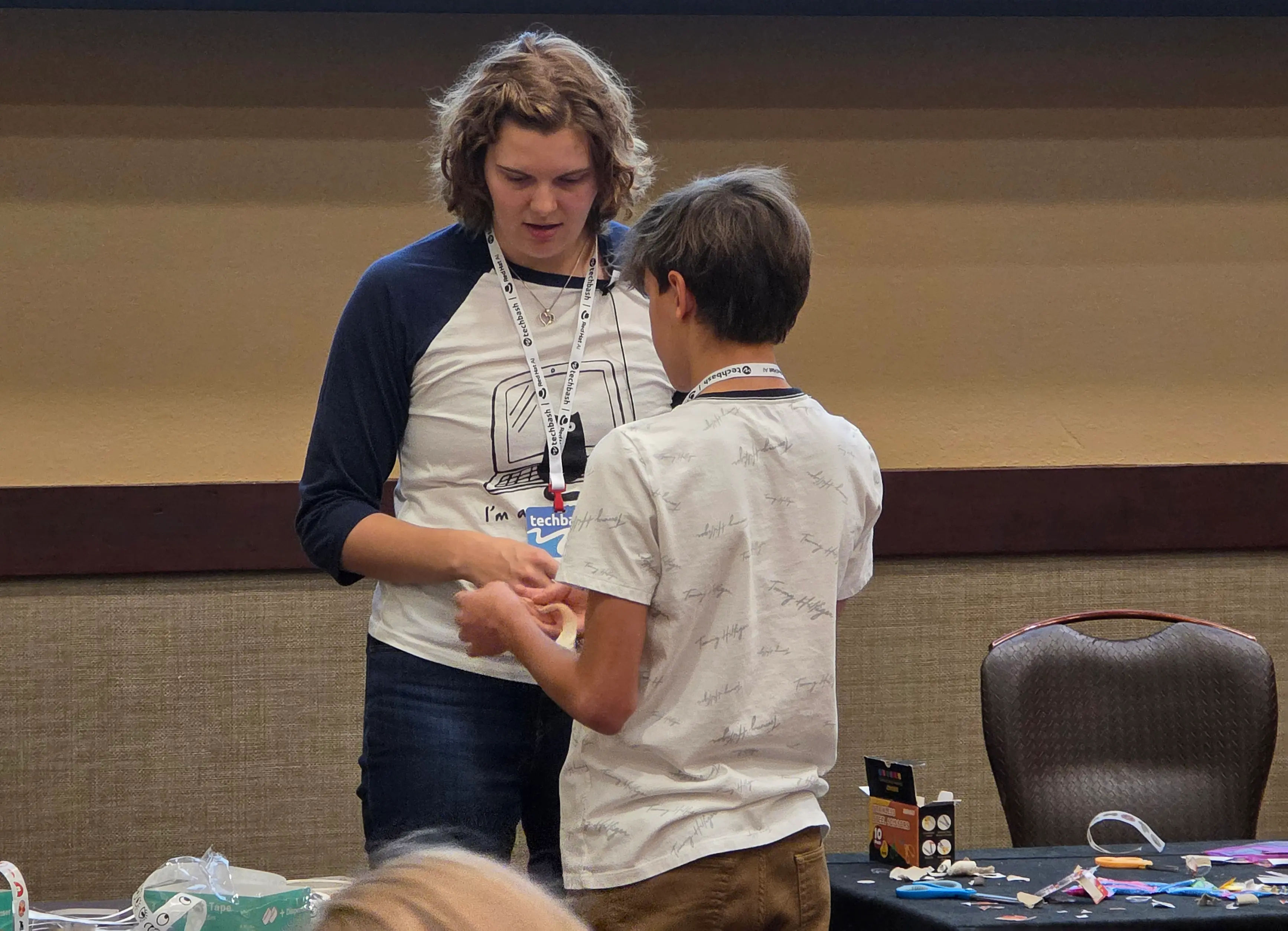 Mandy speaking to a kid about their circuit
