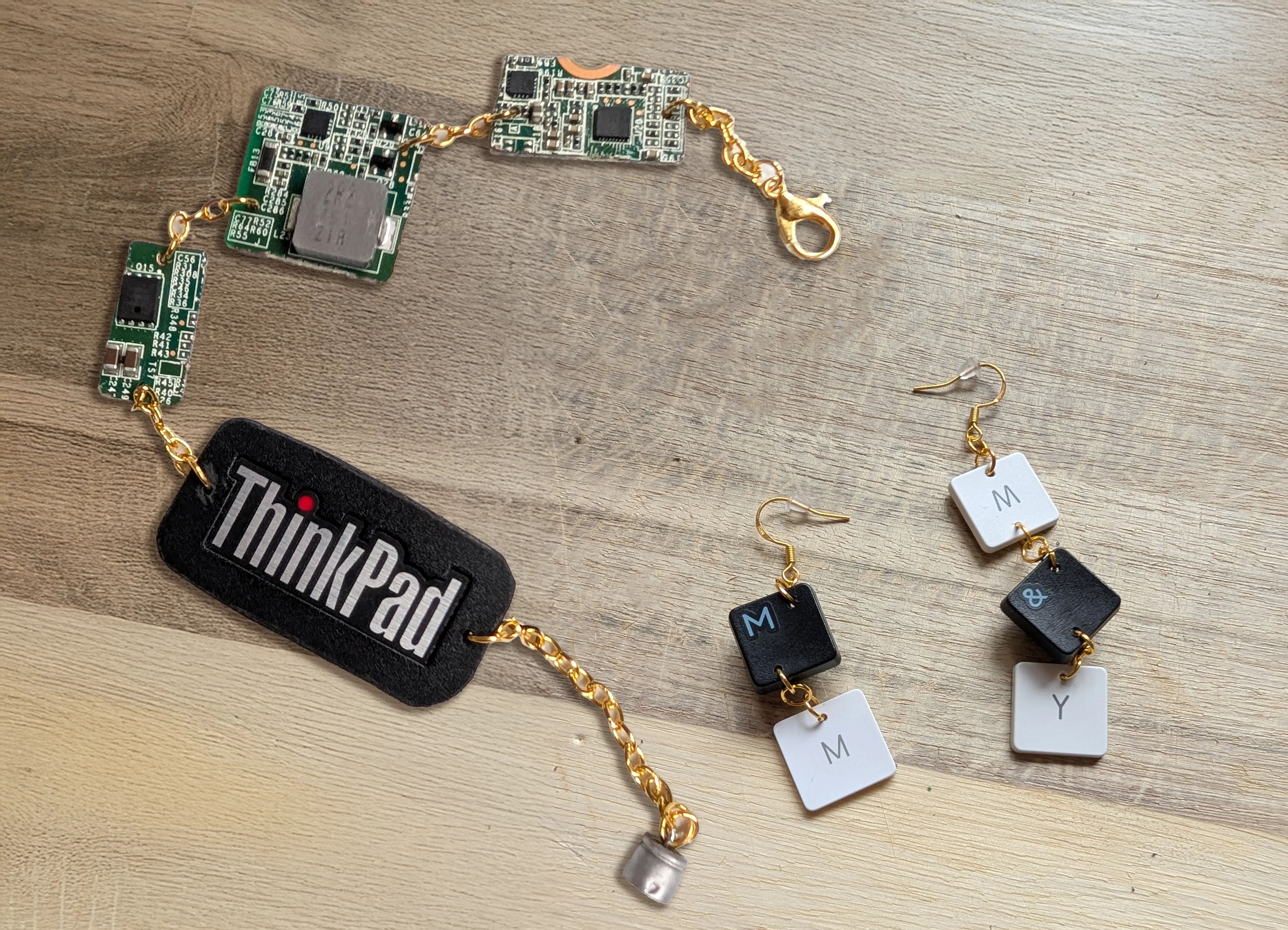 A bracelet made from an old ThinkPad keyboard and earrings made from a keyboard