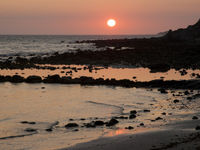 Zonsondergang boven de rotsige kust van Tarifa. © Patrick Keirsebilck
