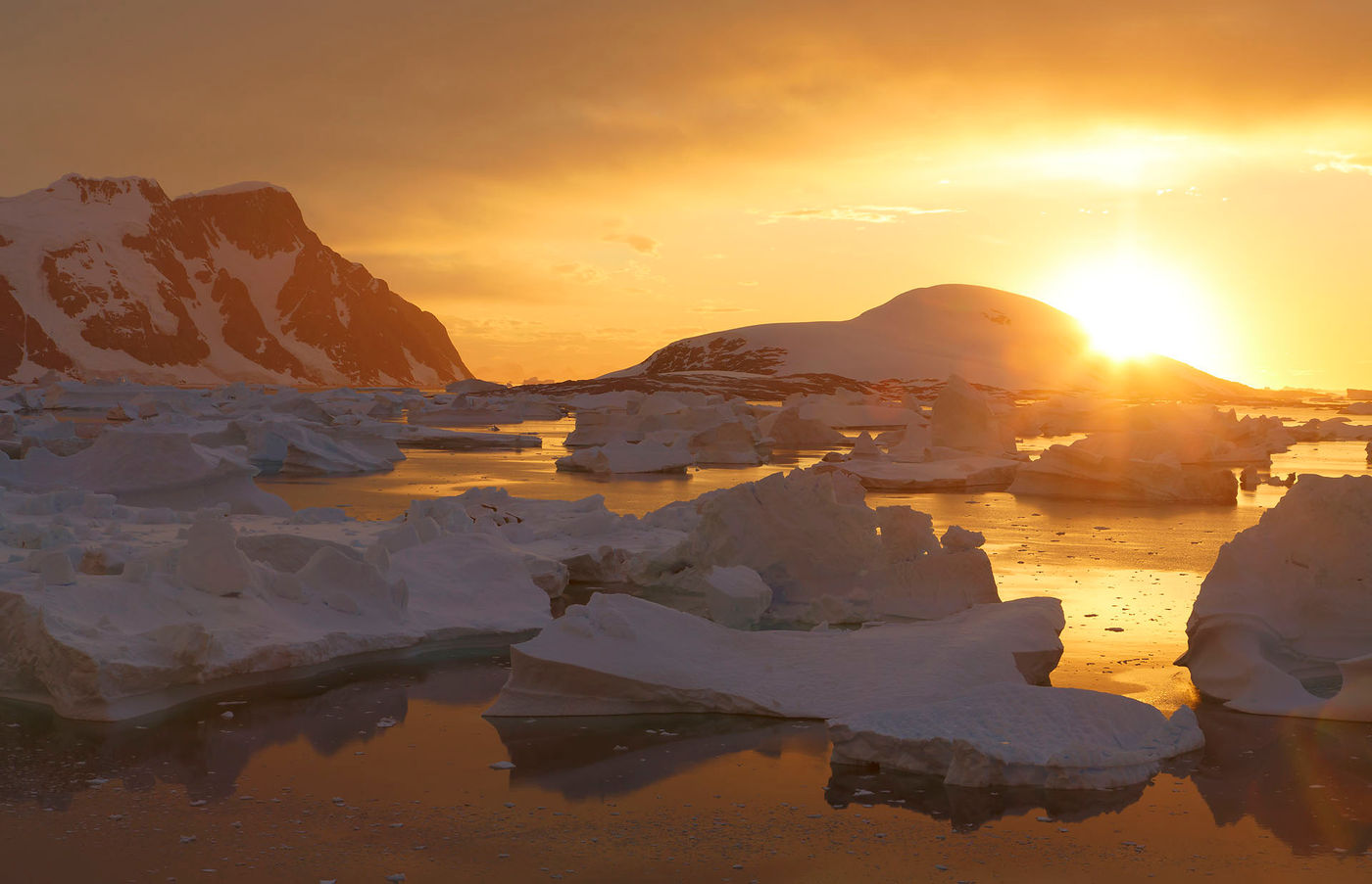 Giant icebergs at sunset in the Bellinghausen Sea, from  Booth Island, Antarctica.