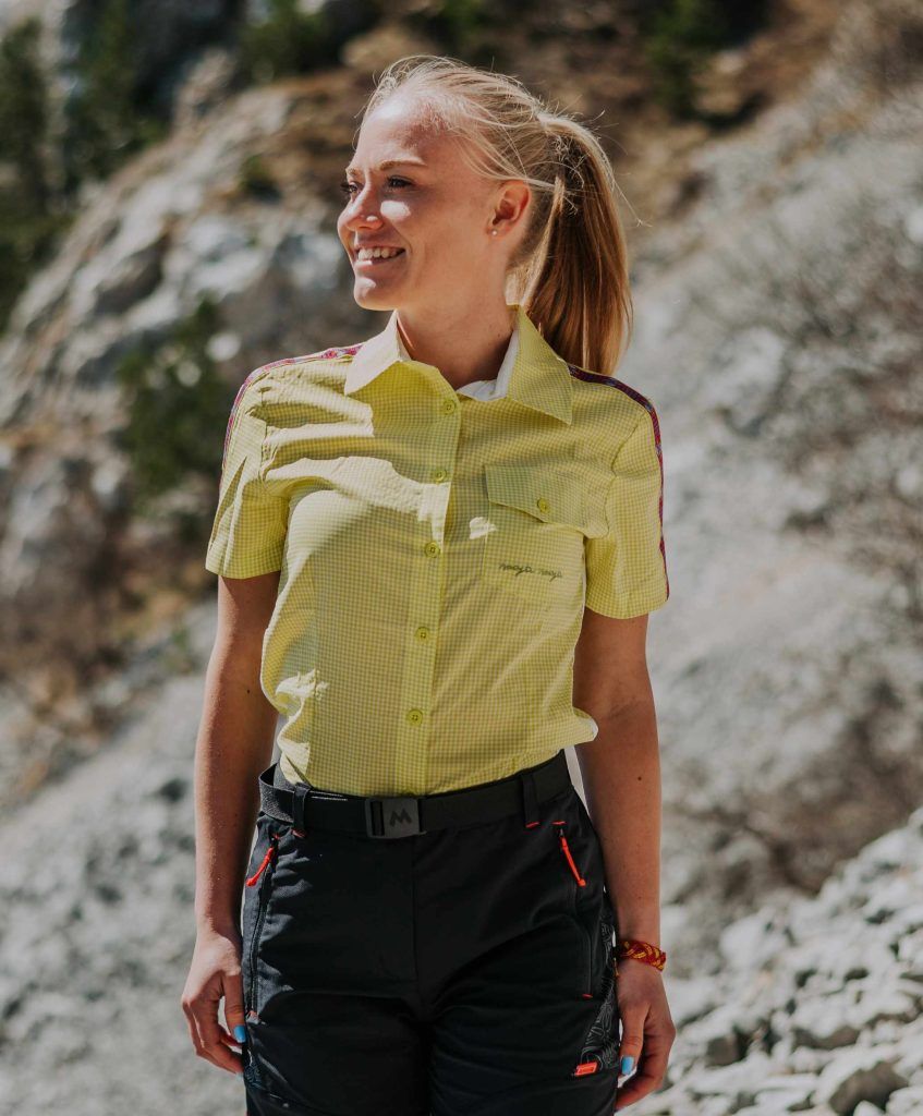 Women wearing a yellow short-sleeve hiking shirt from MAYA MAYA