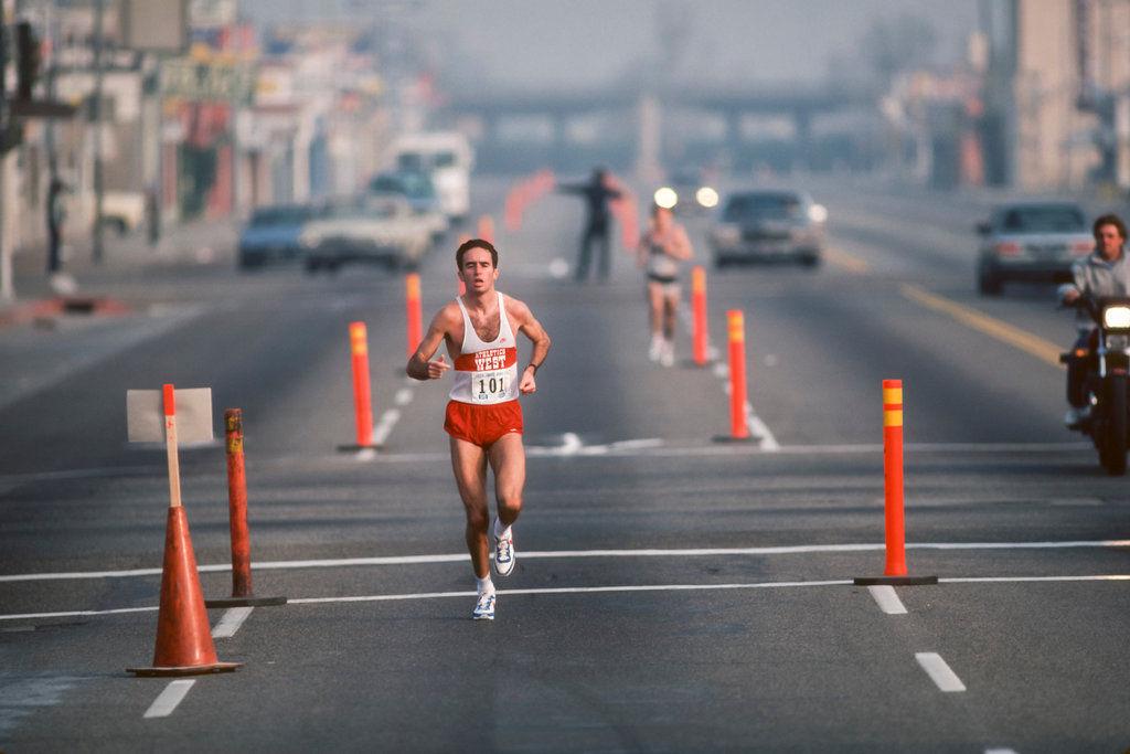 Alberto Salazar running in the street.