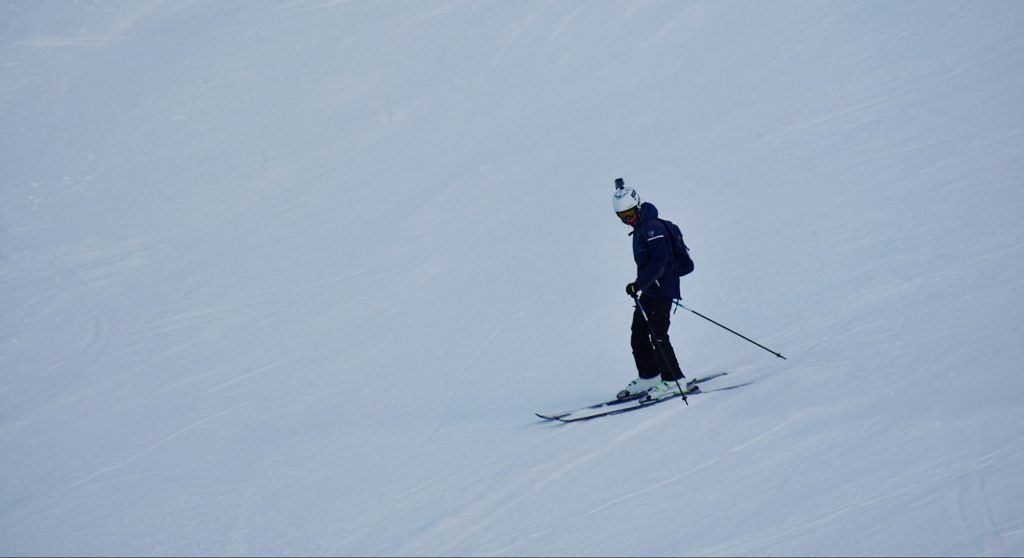 A person skiing in the snowy maintain.