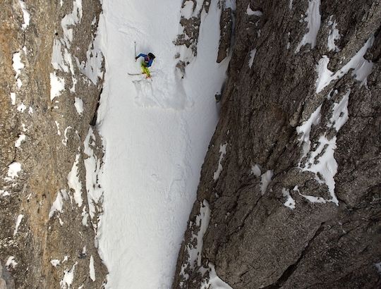 Man skiing in a couloir.