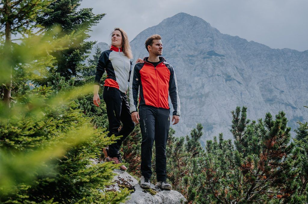 Man and women hiking on a cloudy day in the mountains