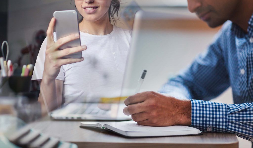 Man and woman sitting in a office