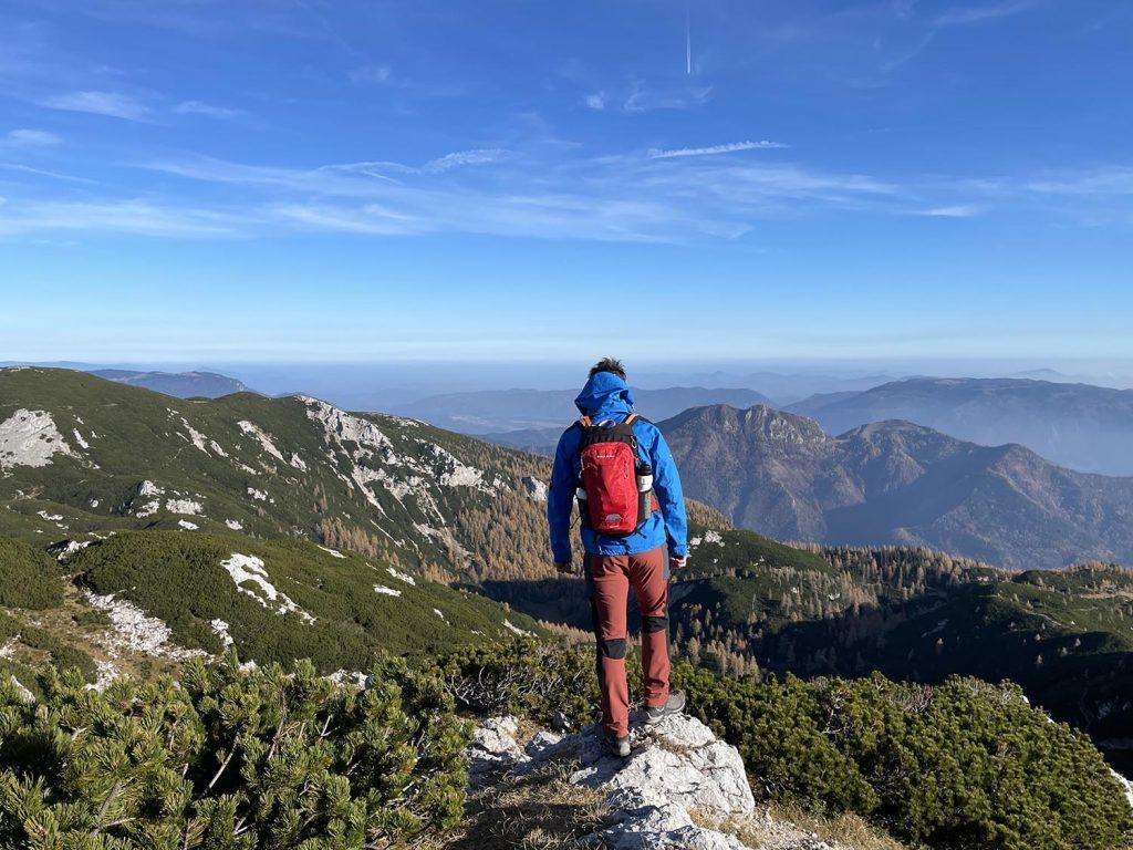 A man standing on top of a mountain.