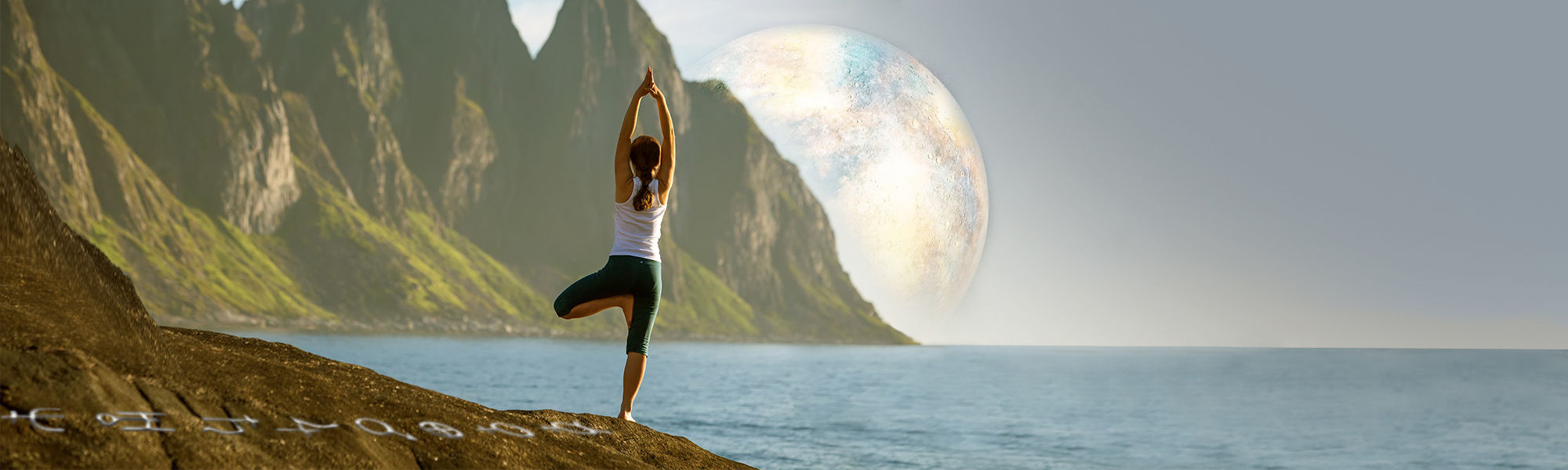 Yoga pose by the sea and mountains.