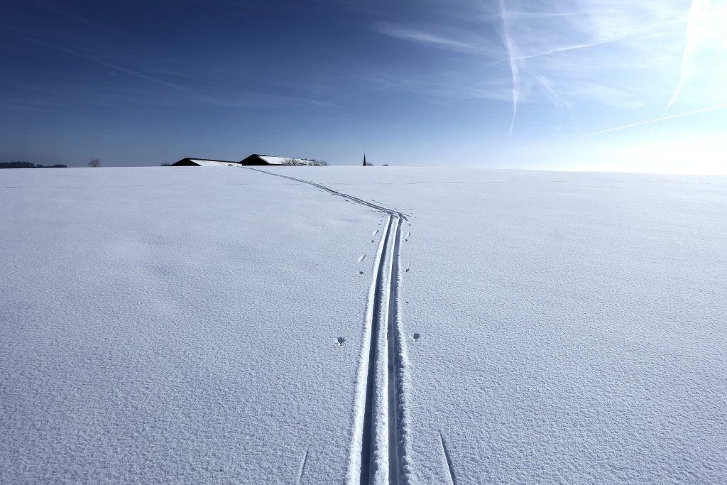 Path in the snow made by skis.