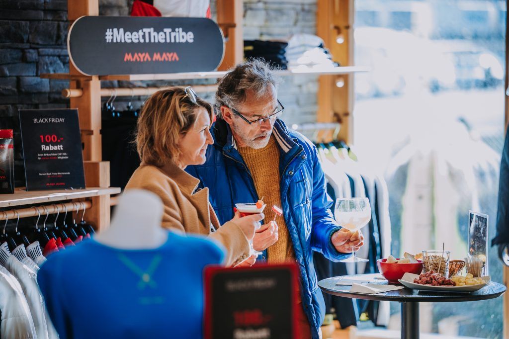 Customers drinking cocktails at an event.