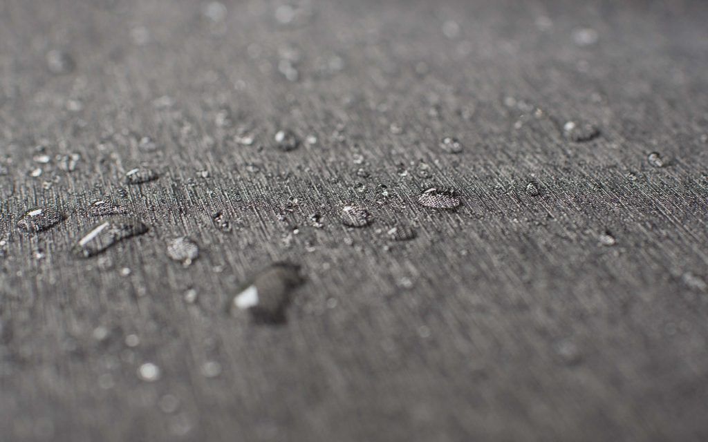 Softshell waterproof material with waterdrops on it.
