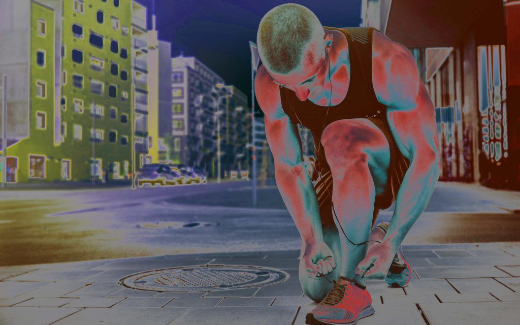 Thermal image of a runner trying to tie his shoelaces.