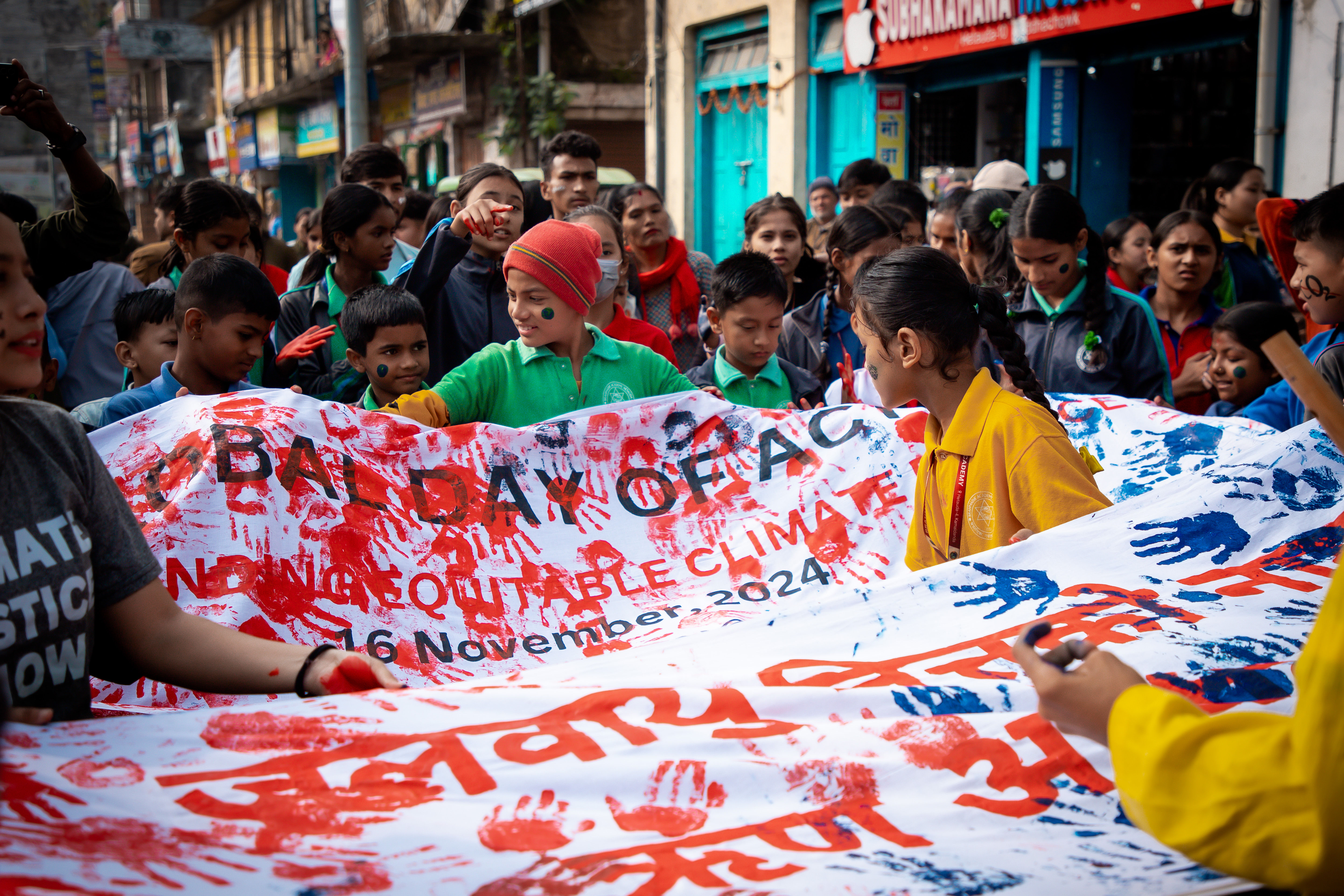 Climate protest with youth holding a globe balloon