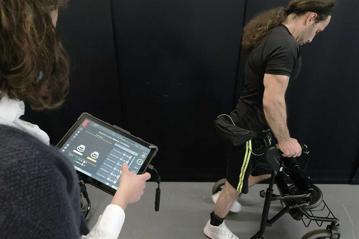 As part of a small clinical trial, Michel Roccati uses an implanted electrical stimulator to activate his spine, allowing him to move around without a wheelchair after his spinal cord injury. (Credit:  Jimmy Ravier via Science News)