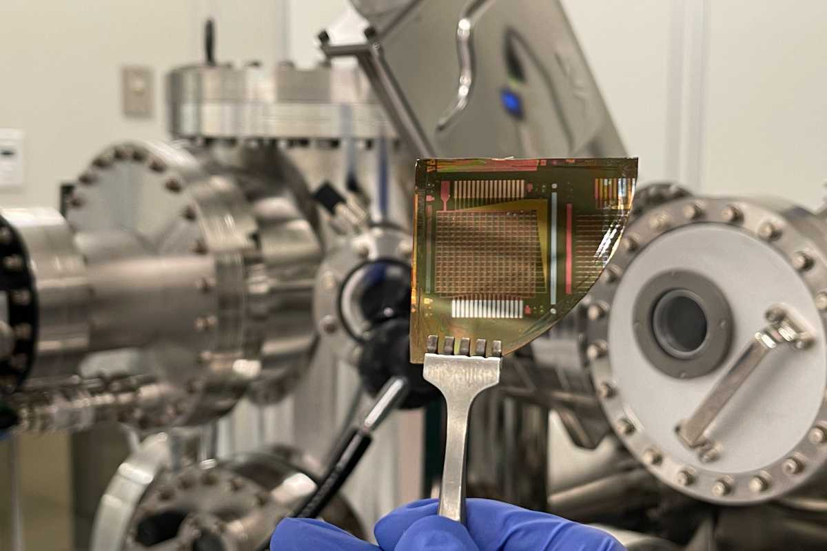 Justin Kim, a doctoral student in the laboratory of Sang-Hoon Bae, assistant professor of mechanical engineering & materials science in the McKelvey School of Engineering at Washington University in St. Louis, displays a sample of a new 2D material created for next-generation electronics. (photo courtesy Bae lab)