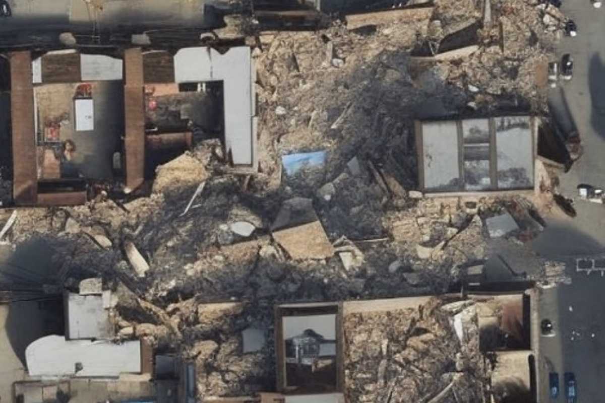 Satellite images can be synthesized using GeoSynth based on given text prompts. In this example, the model uses a street map to determine the layout and the text prompt “city after earthquake” to fill in the style details of the created satellite image. (Image: Srikumar Sastry)