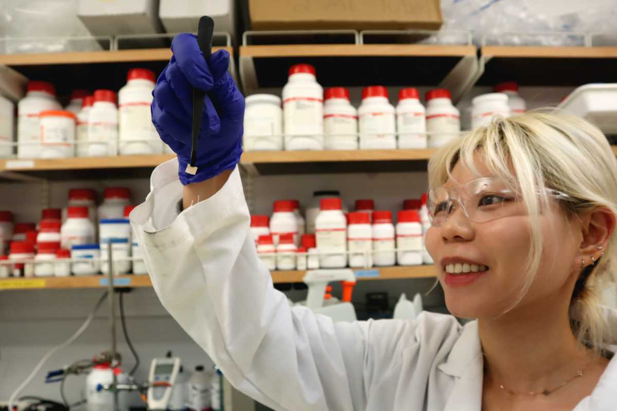 Juya Jeon uses tweezers to hold the engineered hydrogel in Fuzhong Zhang’s lab (Photo: Juya Jeon)