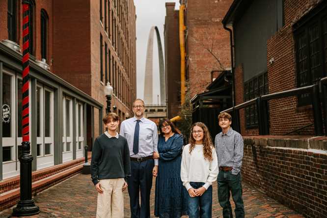 Alumna Isabel Acevedo with her family at Laclede's Landing on the St. Louis riverfront. (Credit: Samantha McRoy) 