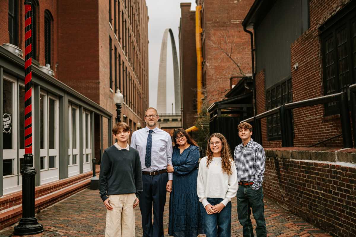 Alumna Isabel Acevedo with her family at Laclede's Landing on the St. Louis riverfront. (Credit: Samantha McRoy) 