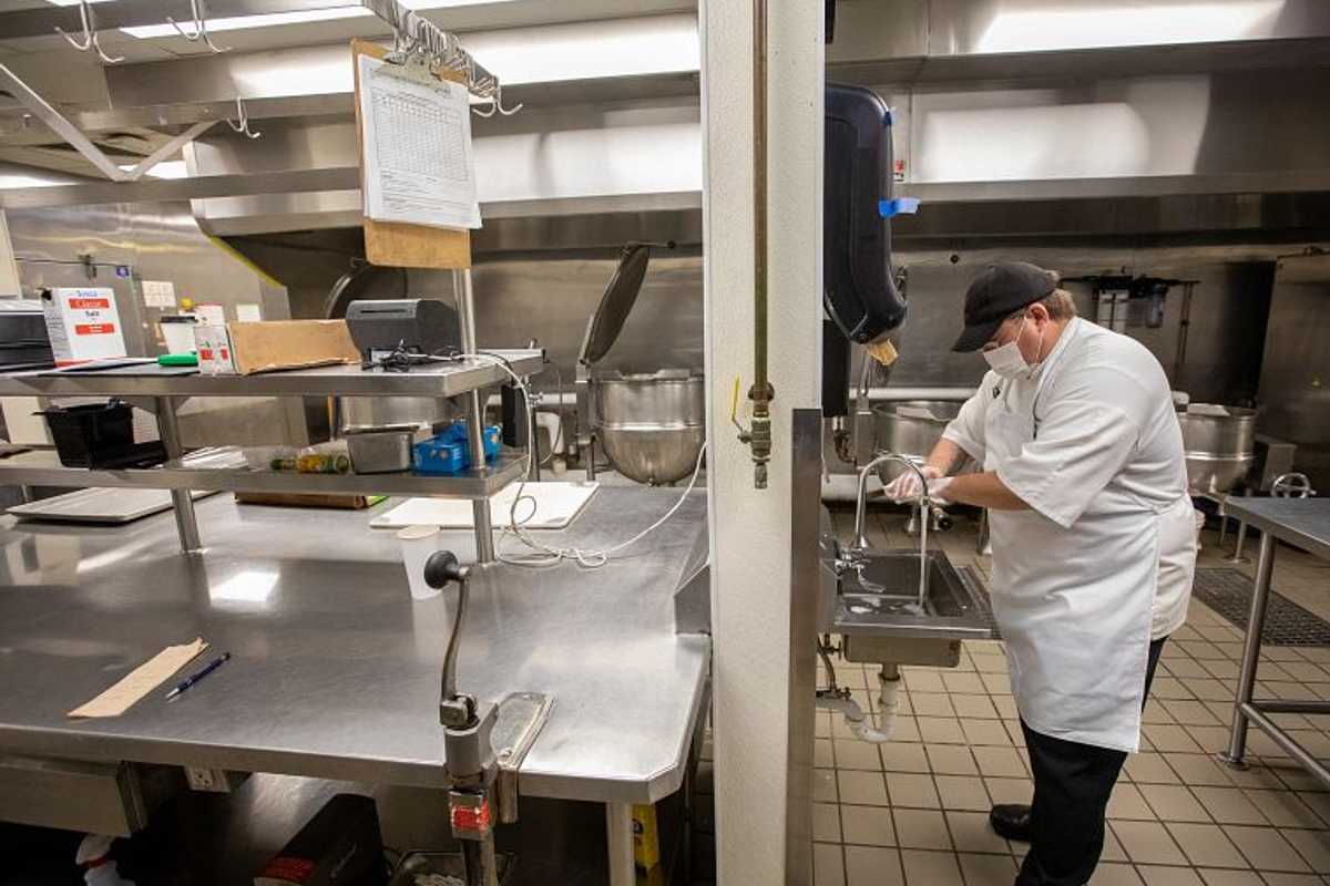 Zhen (Jason) He at the McKelvey School of Engineering used wastewater from University Dining Services to compare traditional algae-growing methods to his novel method, which includes extracting nutrients first, and then using them to grow algae outside of the water. (Photo: Joe Angeles/Washington University)