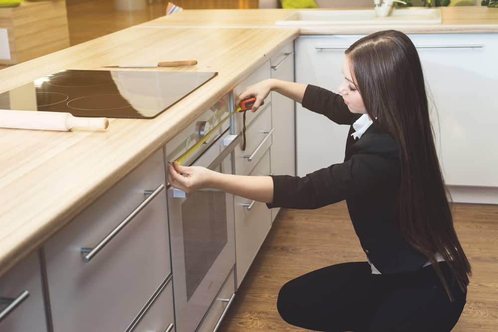 Designer measuring kitchen