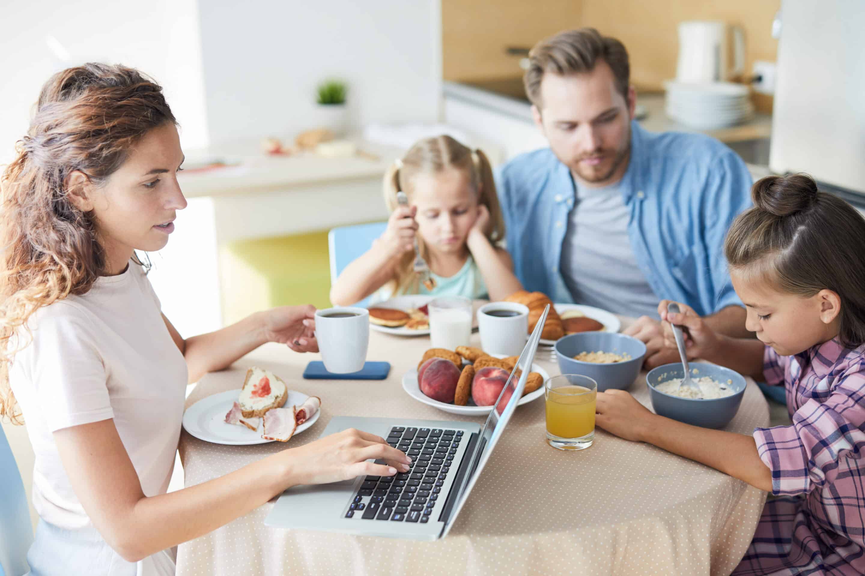 Busy,Young,Mom,Typing,On,Laptop,Keypad,While,Searching,For Busy Family