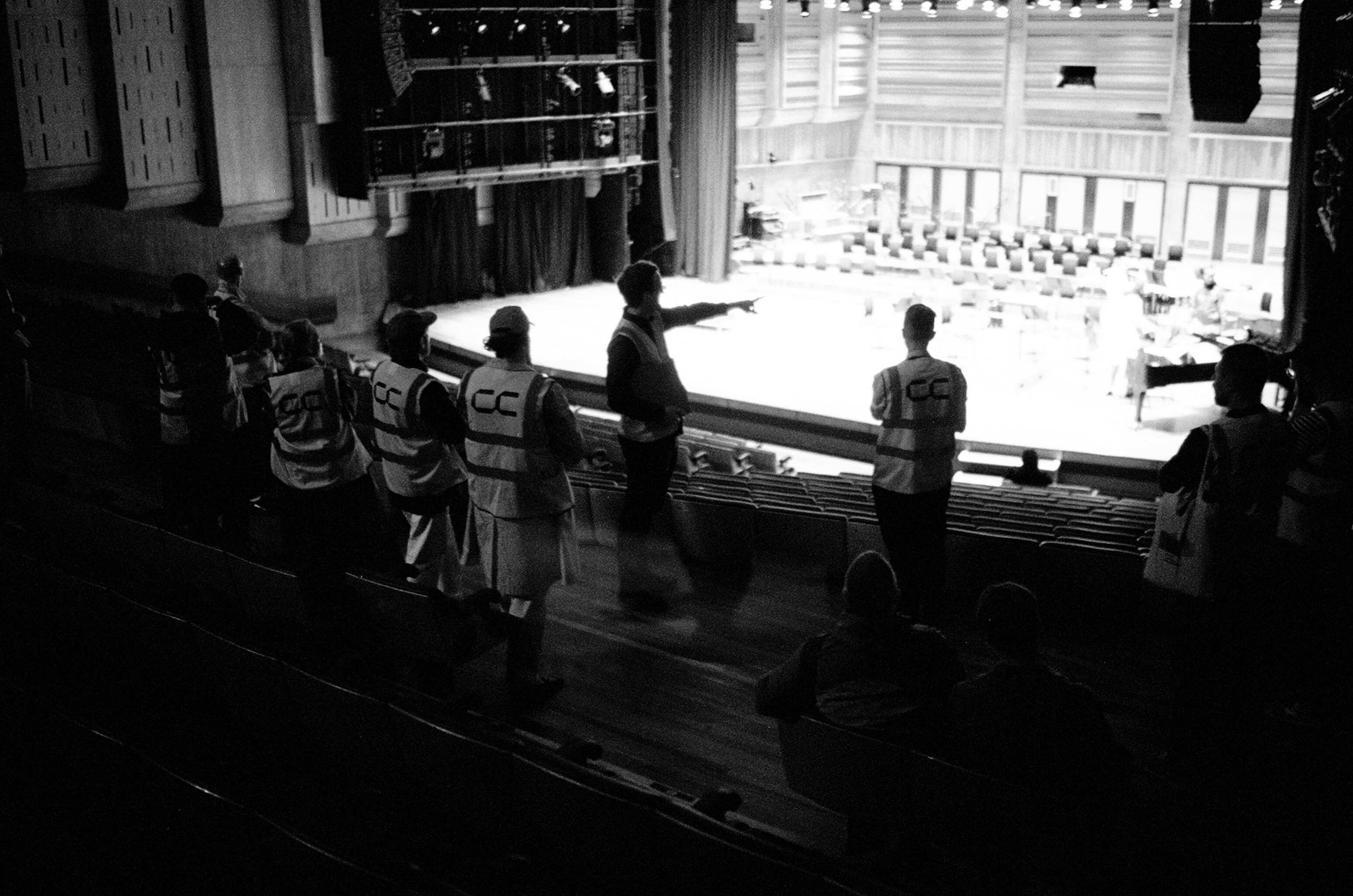 A silhouetted shot of a group of people on a tour guide of the main hall at the Southbank Centre, London.