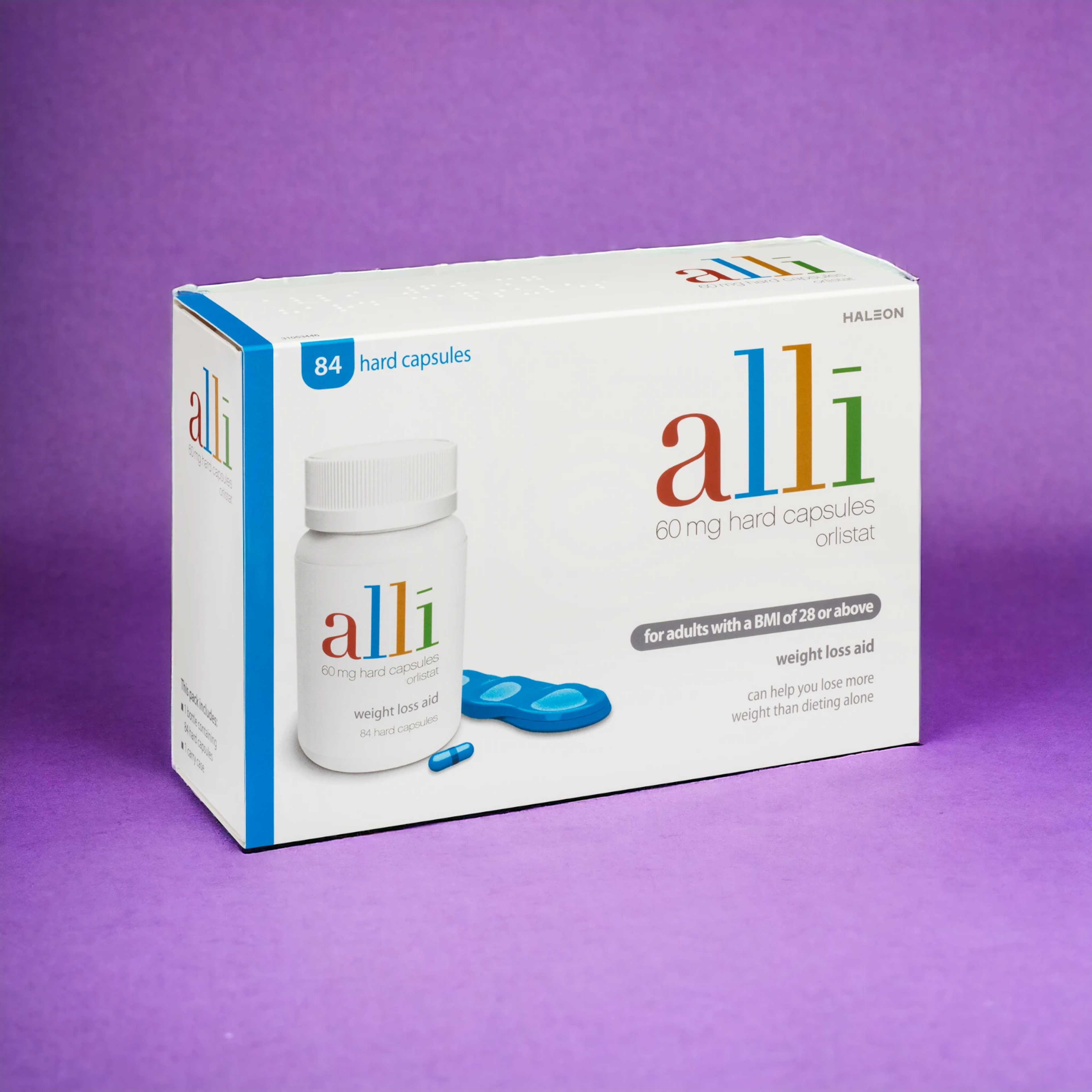 Alli pills on purple background