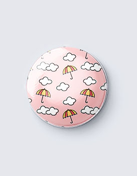 Clouds and Umbrellas (peach) - Badge
