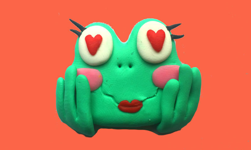 Photo of a sculpted comic frog communicating lust