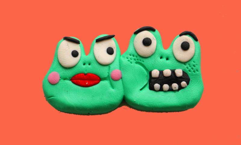 Photo of a sculpted comic frog communicating Sex differences