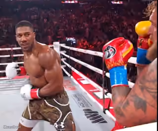 Anthony Joshua Smirking at Jake Paul