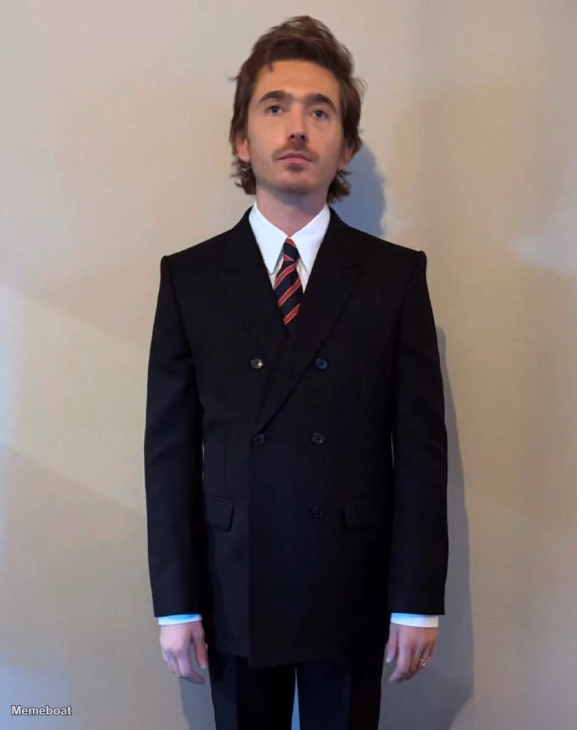 Austin Abrams in a Suit and Tie - meme generator image preview