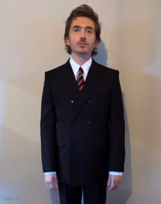 Austin Abrams in a Suit and Tie