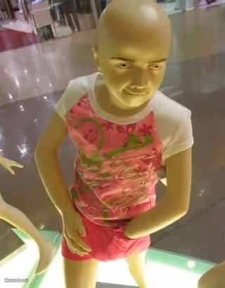 Bald Mannequin Looking Down