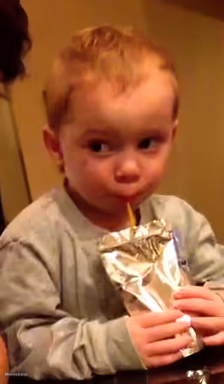 Boy Sipping Juice Box