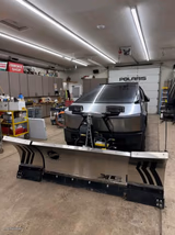 Oversized Snow Plow Truck In Garage