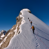 Climbers On Snowy Ridge