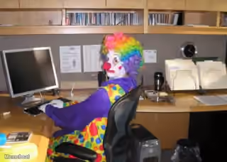 Clown At Desk