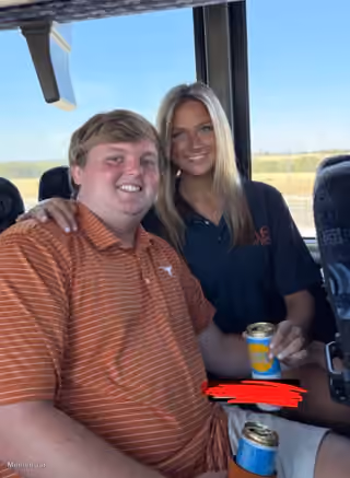 Couple on Bus with Texas Longhorns Polo