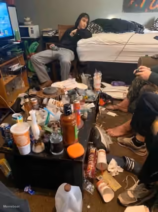 Dirty College Dorm Room With Trash