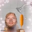 ed sheeran holding a corn dog in the shower
