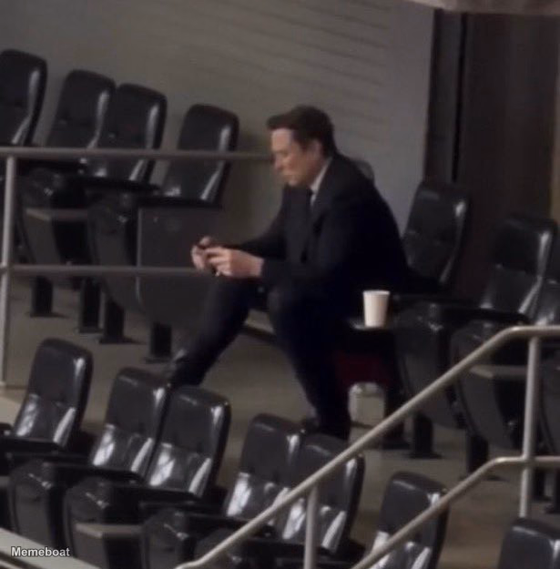 Elon Musk Using Mobile in an Empty Stadium - meme generator image preview