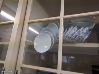 Falling Plates in Closed Cupboard