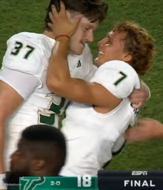 Football Players Romantic Hug Celebration