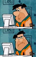 Fred Flintstone annoyed at computer