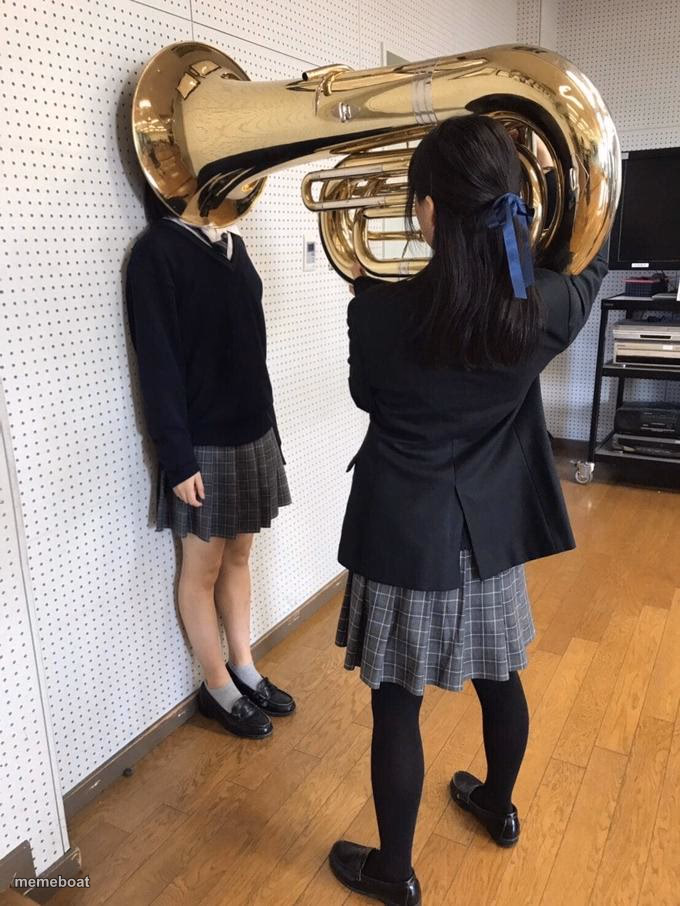 Girl Putting Tuba on Girl's Head - meme generator image preview