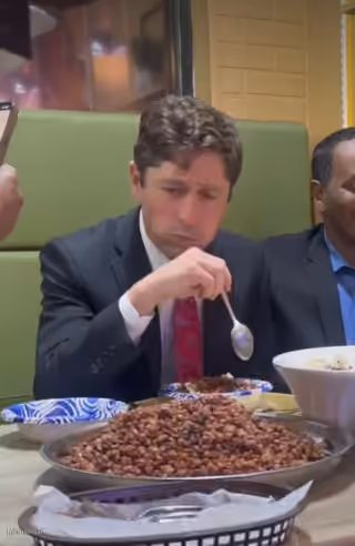 Gov Frey Struggling to Eat Somalian Food